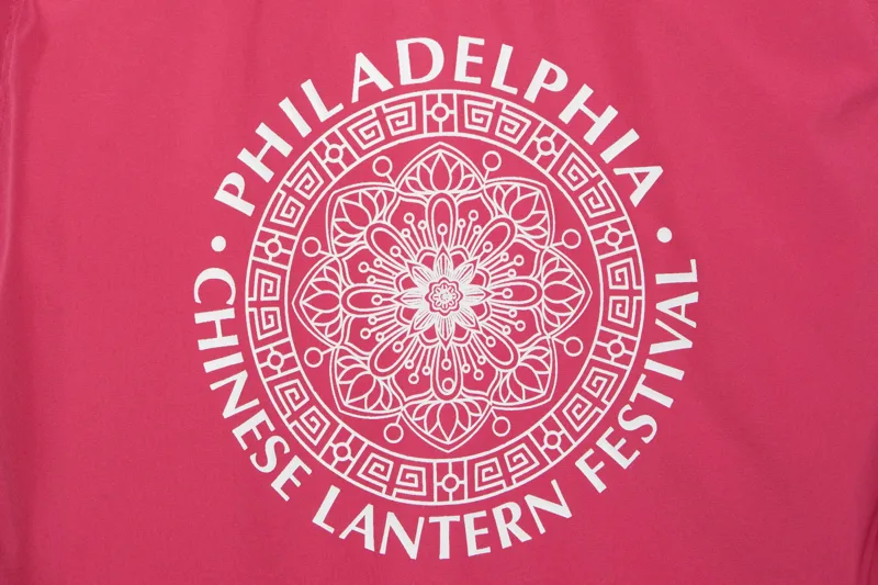 Screen-printed white graphic on a pink shirt